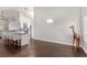 Open-concept living room features hardwood floors, modern lighting, and a view into the kitchen at 1084 Little House Ct, Henderson, NV 89011