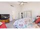 Spacious primary bedroom with a TV, and access to the living room at 1084 Little House Ct, Henderson, NV 89011