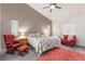 Cozy main bedroom with vaulted ceiling, comfortable seating, and natural light at 1084 Little House Ct, Henderson, NV 89011