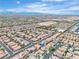 Vast aerial view showcasing houses, streets, and desert views at 10886 Porto Foxi St, Las Vegas, NV 89141