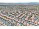 Expansive aerial view of a well-planned community, showcasing numerous homes and neighborhood streets at 10886 Porto Foxi St, Las Vegas, NV 89141