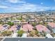 Overview of a neighborhood featuring uniform houses, landscaping, and distant mountains at 10886 Porto Foxi St, Las Vegas, NV 89141