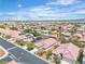 Aerial view showcasing a neighborhood with houses and desert surroundings at 10886 Porto Foxi St, Las Vegas, NV 89141