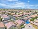 Wide aerial shot of a sprawling residential area with desert landscape and mountain backdrop at 10886 Porto Foxi St, Las Vegas, NV 89141