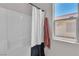 Bathroom featuring a white shower curtain, and a window to the exterior at 10886 Porto Foxi St, Las Vegas, NV 89141