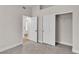 Bedroom featuring carpet floors, closet, and ensuite bath at 10886 Porto Foxi St, Las Vegas, NV 89141