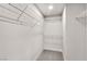 Walk-in closet featuring shelving and carpet flooring at 10886 Porto Foxi St, Las Vegas, NV 89141