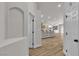Welcoming entryway featuring archway design and views of the modern kitchen and open-concept living area at 10886 Porto Foxi St, Las Vegas, NV 89141