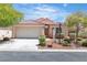 Charming single-story home with a well-maintained front yard and a two-car garage at 10886 Porto Foxi St, Las Vegas, NV 89141