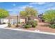 Charming single-story home with a well-maintained front yard and a two-car garage at 10886 Porto Foxi St, Las Vegas, NV 89141