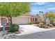 Charming single-story home with a well-maintained front yard and a two-car garage at 10886 Porto Foxi St, Las Vegas, NV 89141