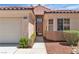 Charming single-story home features a tile roof, two-car garage, and well-maintained landscaping at 10886 Porto Foxi St, Las Vegas, NV 89141