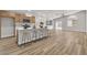 Bright kitchen with white countertops, wood cabinets, stainless appliances, and adjacent to the living room at 10886 Porto Foxi St, Las Vegas, NV 89141