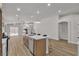 Well-lit kitchen with island featuring pendant lighting and stainless steel dishwasher at 10886 Porto Foxi St, Las Vegas, NV 89141