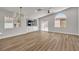 Contemporary living room with recessed lighting, light hardwood flooring, and sliding glass doors to the backyard at 10886 Porto Foxi St, Las Vegas, NV 89141