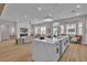 Bright, open-concept living room with modern finishes and a large kitchen island for entertaining at 10886 Porto Foxi St, Las Vegas, NV 89141