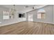 Bright living room with wood floors, recessed lighting, and a modern ceiling fan at 10886 Porto Foxi St, Las Vegas, NV 89141