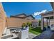 Relaxing backyard with a modern fire pit, outdoor seating, and a serene water feature at 10968 Tracy Stevens Ave, Las Vegas, NV 89166