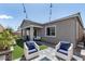 Cozy backyard with a fire pit, patio, and lush green turf, perfect for outdoor living at 10968 Tracy Stevens Ave, Las Vegas, NV 89166