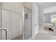 Modern tiled shower with sleek glass door and convenient built-in shelving at 10968 Tracy Stevens Ave, Las Vegas, NV 89166