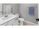 Bright bathroom with a modern vanity, white countertop, and contemporary fixtures at 10968 Tracy Stevens Ave, Las Vegas, NV 89166