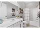 Bathroom featuring a modern vanity, toilet, bathtub, and shower with a modern shower curtain at 10968 Tracy Stevens Ave, Las Vegas, NV 89166