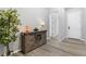 Inviting entryway showcasing rustic furniture, stylish decor, and wood-look floors at 10968 Tracy Stevens Ave, Las Vegas, NV 89166