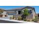 Beautiful single-story home showcasing a manicured front yard and a spacious two-car garage at 10968 Tracy Stevens Ave, Las Vegas, NV 89166