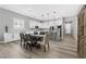 Bright, modern kitchen featuring white cabinets, stainless steel appliances, and a central island with bar seating at 10968 Tracy Stevens Ave, Las Vegas, NV 89166