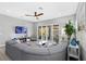 Bright living room with an open floor plan, comfortable seating, and sliding glass doors to outdoor space at 10968 Tracy Stevens Ave, Las Vegas, NV 89166