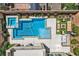 Stunning aerial view of a backyard featuring a pool, spa, and outdoor living spaces at 1113 Via Della Costrella, Henderson, NV 89011