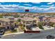 Aerial view of two-story home with solar panels, backyard pool, and desert landscape at 1113 Via Della Costrella, Henderson, NV 89011