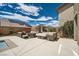 Spacious backyard patio with outdoor furniture, perfect for entertaining guests or relaxing outside at 1113 Via Della Costrella, Henderson, NV 89011