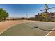 Outdoor basketball court with well-kept surface and hoop, surrounded by greenery at 1113 Via Della Costrella, Henderson, NV 89011