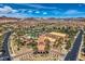 Stunning aerial view of the community center featuring a pool and lush landscaping at 1113 Via Della Costrella, Henderson, NV 89011