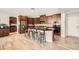 Bright kitchen with stainless steel appliances, dark countertops, and a spacious island at 1113 Via Della Costrella, Henderson, NV 89011