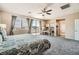 Large bedroom with a balcony, desk area, and serene views of the outdoors at 1113 Via Della Costrella, Henderson, NV 89011