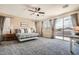 Spacious main bedroom featuring ample natural light and a private balcony access at 1113 Via Della Costrella, Henderson, NV 89011
