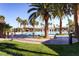 Lushly landscaped pool area with various seating and shade structures at 1113 Via Della Costrella, Henderson, NV 89011