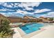 Beautiful backyard oasis with a sparkling pool, spa, and outdoor seating area, perfect for entertaining at 1113 Via Della Costrella, Henderson, NV 89011