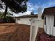 Spacious backyard featuring mature trees and a chimney at 1126 Azul Way, Boulder City, NV 89005