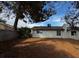 A large backyard has ample space and privacy with a block wall and mature trees at 1126 Azul Way, Boulder City, NV 89005