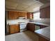 Functional kitchen features lots of cabinet storage and a window above the sink at 1126 Azul Way, Boulder City, NV 89005