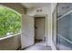 Showing the water heater inside a storage closet on a cozy balcony with a view of lush greenery at 1420 Red Crest Ln # 202, Las Vegas, NV 89144