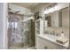 Bathroom featuring walk-in shower, sink, and shelving at 1420 Red Crest Ln # 202, Las Vegas, NV 89144