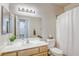 Well-lit bathroom with modern fixtures, vanity, and open doorway at 1420 Red Crest Ln # 202, Las Vegas, NV 89144