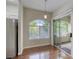 Dining area features hardwood floors and natural lighting from windows at 1420 Red Crest Ln # 202, Las Vegas, NV 89144