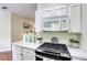 Open kitchen has a stainless steel oven and stove top at 1420 Red Crest Ln # 202, Las Vegas, NV 89144