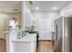 Open kitchen features bright white cabinets and stainless steel appliances at 1420 Red Crest Ln # 202, Las Vegas, NV 89144