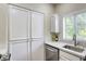 Pantry in kitchen features white cabinets and lots of space at 1420 Red Crest Ln # 202, Las Vegas, NV 89144